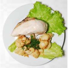 Boiled dietary chicken on a salad sheet